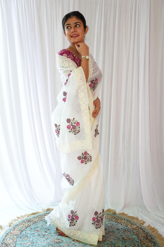Elegant White Saree with Pink Floral Embroidery & Contrast Blouse