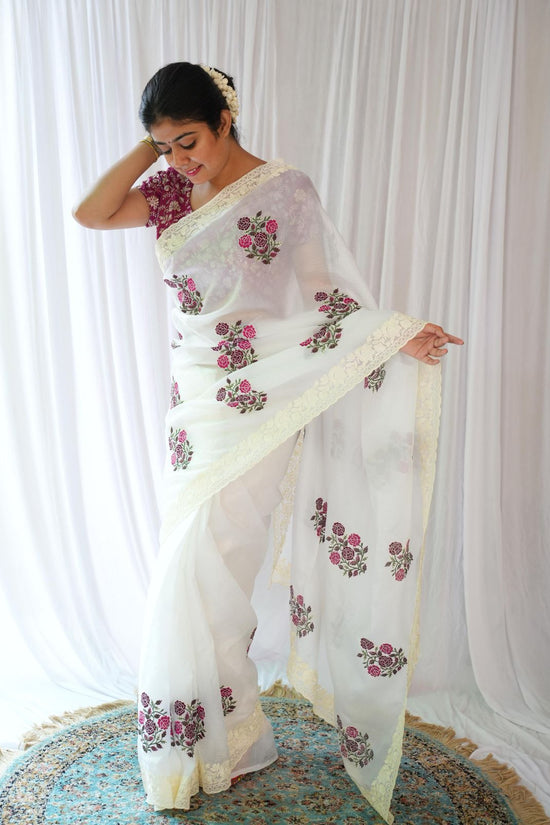 Elegant White Saree with Pink Floral Embroidery & Contrast Blouse